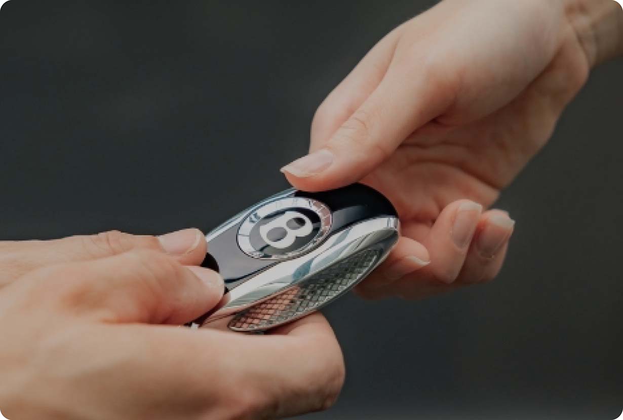 Bentley key being passed from owner to owner