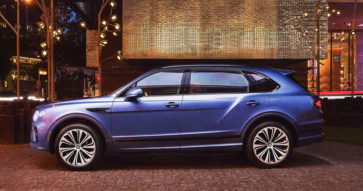 Side profile of a Bentley Bentayga in metallic blue