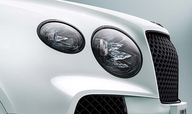 Bentley Bentayga's crystal-cut LED matrix headlights and signature black mesh grille.