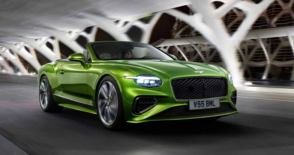 Bentley Continental GTC Speed driving through a tunnel at night, showcasing dynamic lines and LED headlights.