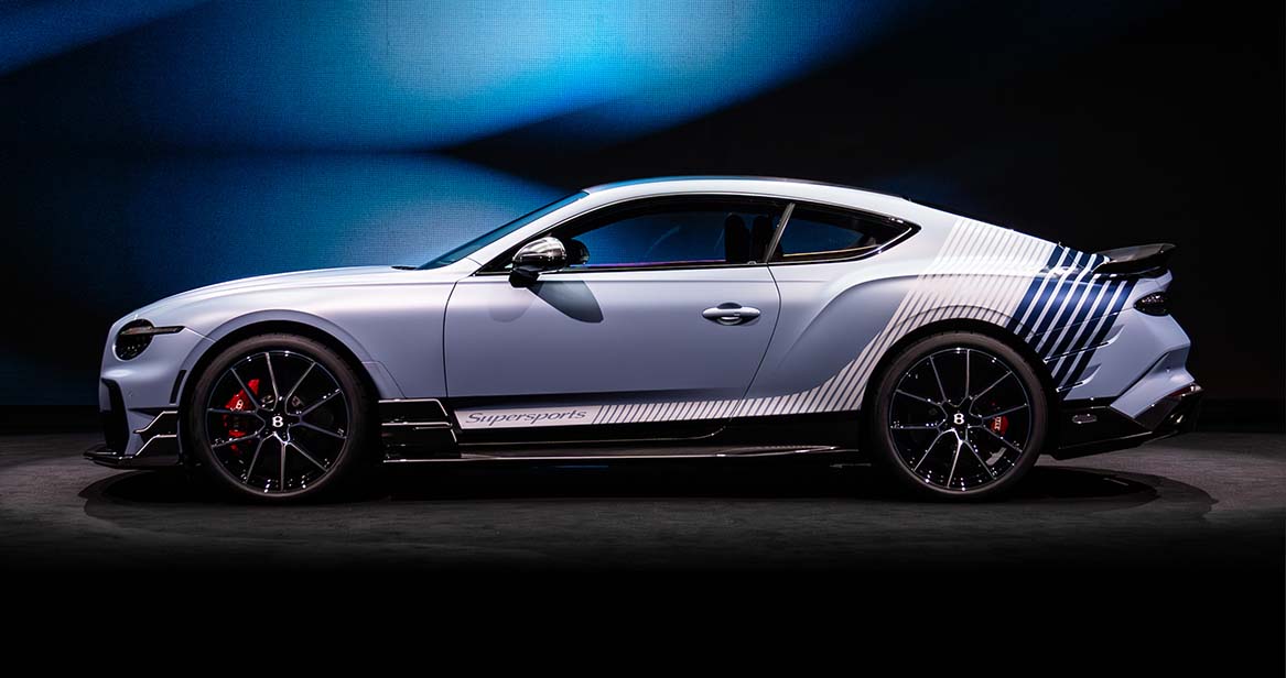 Side view of the 2026 Bentley Supersports showcasing sleek aerodynamic lines, carbon fiber side skirts, and black alloy wheels with red brake calipers.