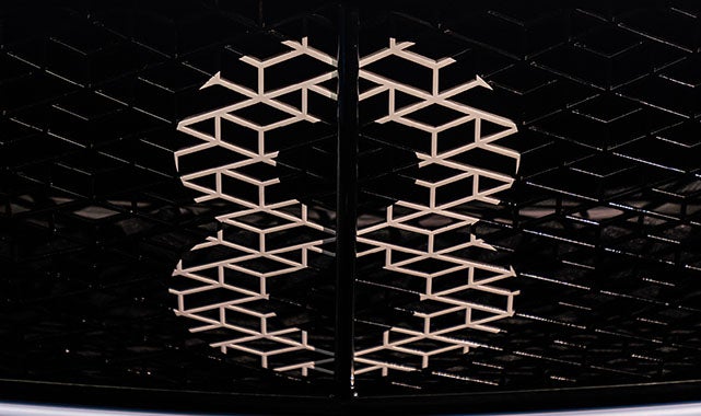 Backlit Bentley B logo integrated into the diamond-pattern front grille design of the 2026 Supersports.